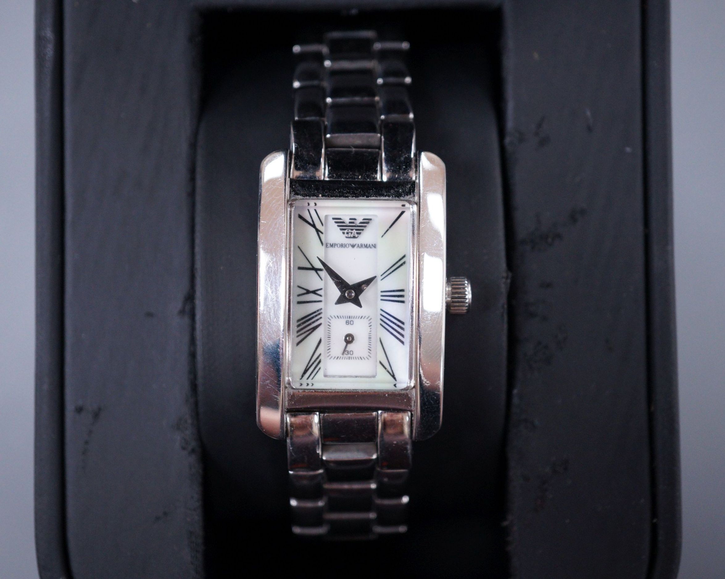 A lady's modern Emporio Armani quartz wrist watch, with mother of pearl dial and box.